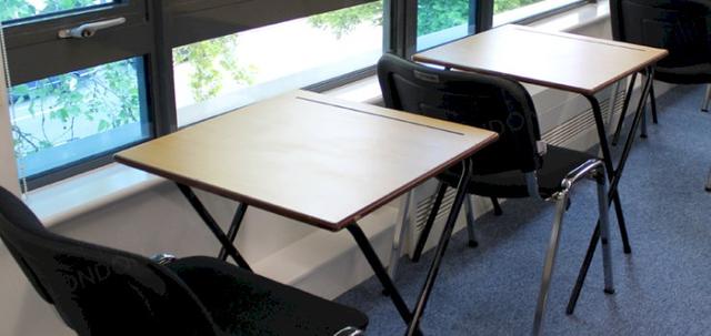 Stacking Chairs Are Great For Exams https://mill-media.s3.eu-west-2.amazonaws.com/online-furniture-hire/article_additional/london-school-exams7/london-school-exams7-740x350.jpg - Exam dream team - desks & stacking chairs.