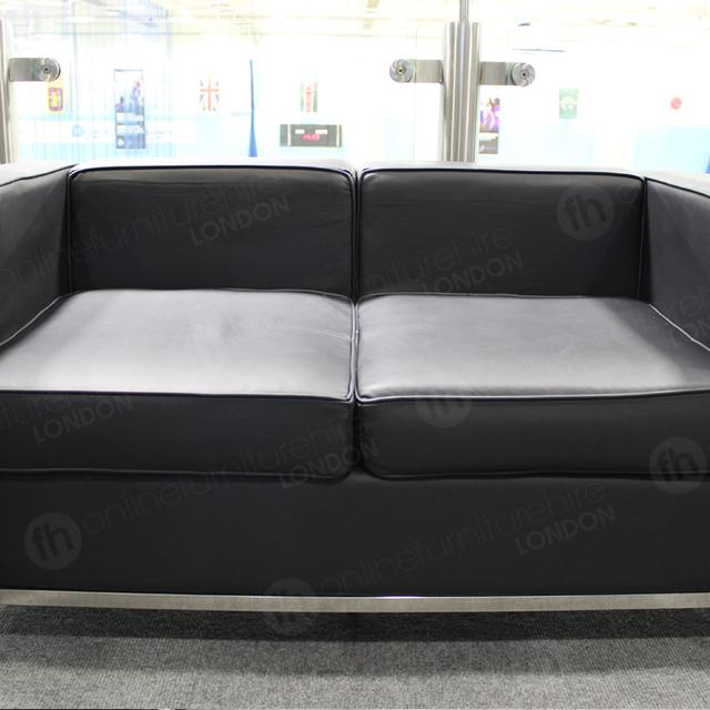 Furniture for Sporting Events https://d1hcs5uofxldvl.cloudfront.net/online-furniture-hire/article_additional/furniture-for-sporting-events4/furniture-for-sporting-events4.jpg - 2 seater black Corbusier sofa for a range of events.