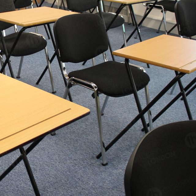 Stacking Chairs Are Great For Exams https://d1hcs5uofxldvl.cloudfront.net/online-furniture-hire/article_additional/london-school-exams11/london-school-exams11.jpg - Premium upholstery can boost pupil productivity.